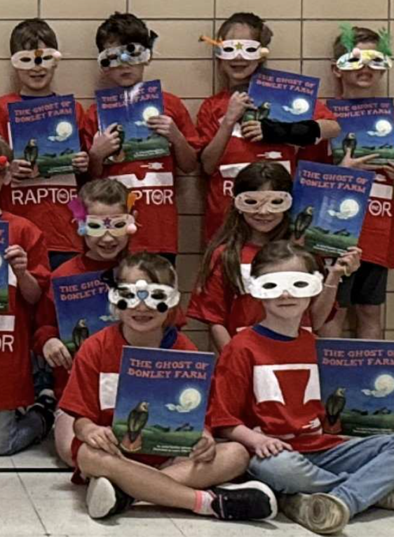 SOAR class in red T-shirts with the SOAR text, "The Ghost of Donley Farm."